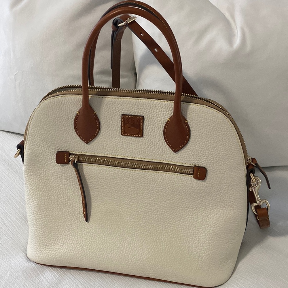 Dooney and Bourke white purse brown handles . Large domed satchel